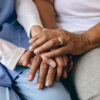 women holding hands dementia