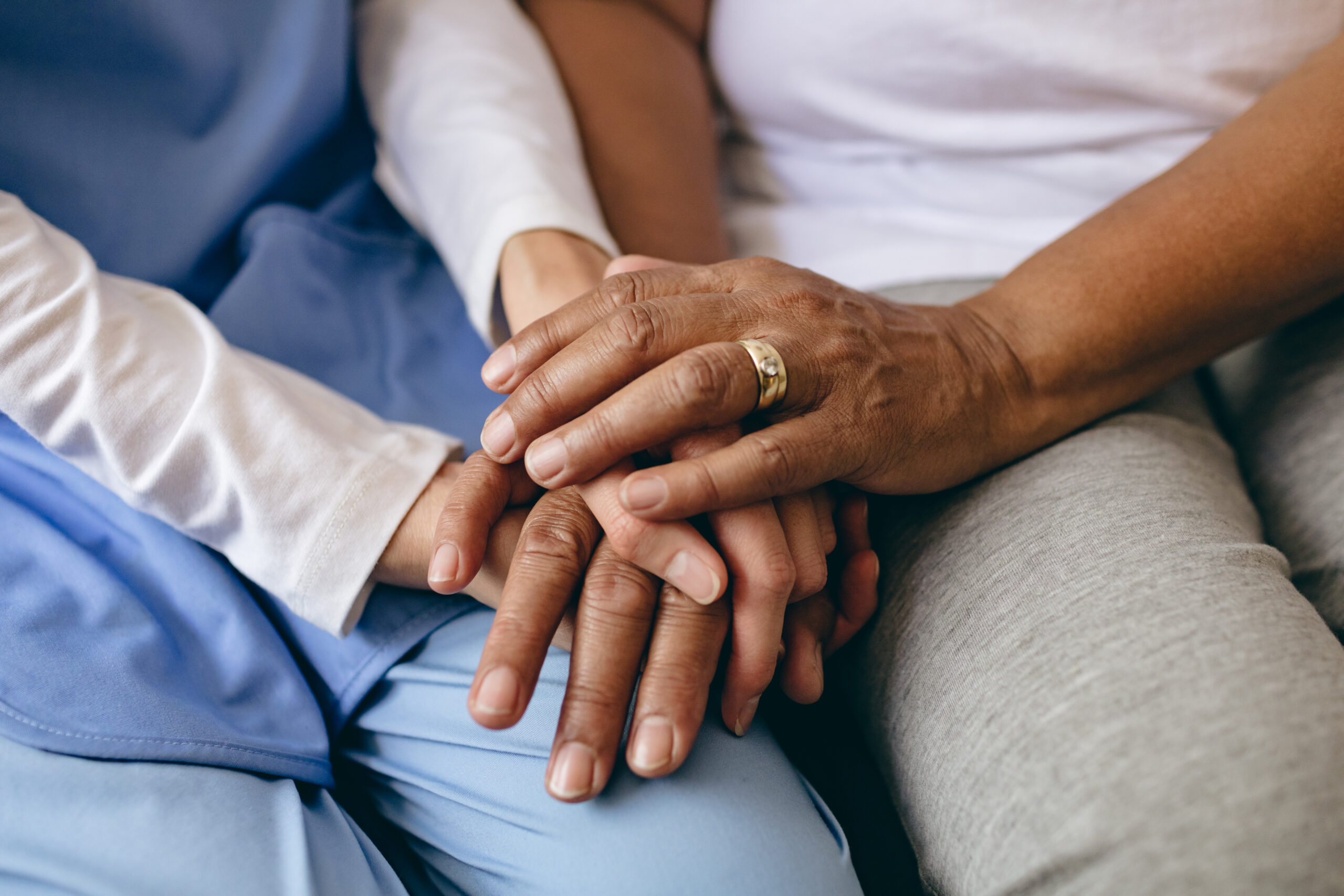 women holding hands dementia